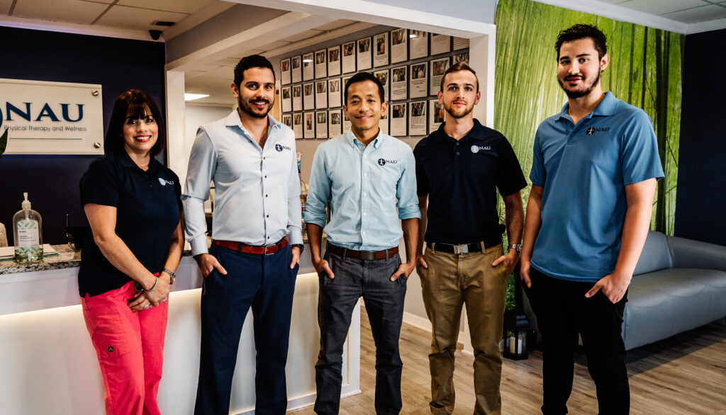 The NAU PT and Wellness team in the office