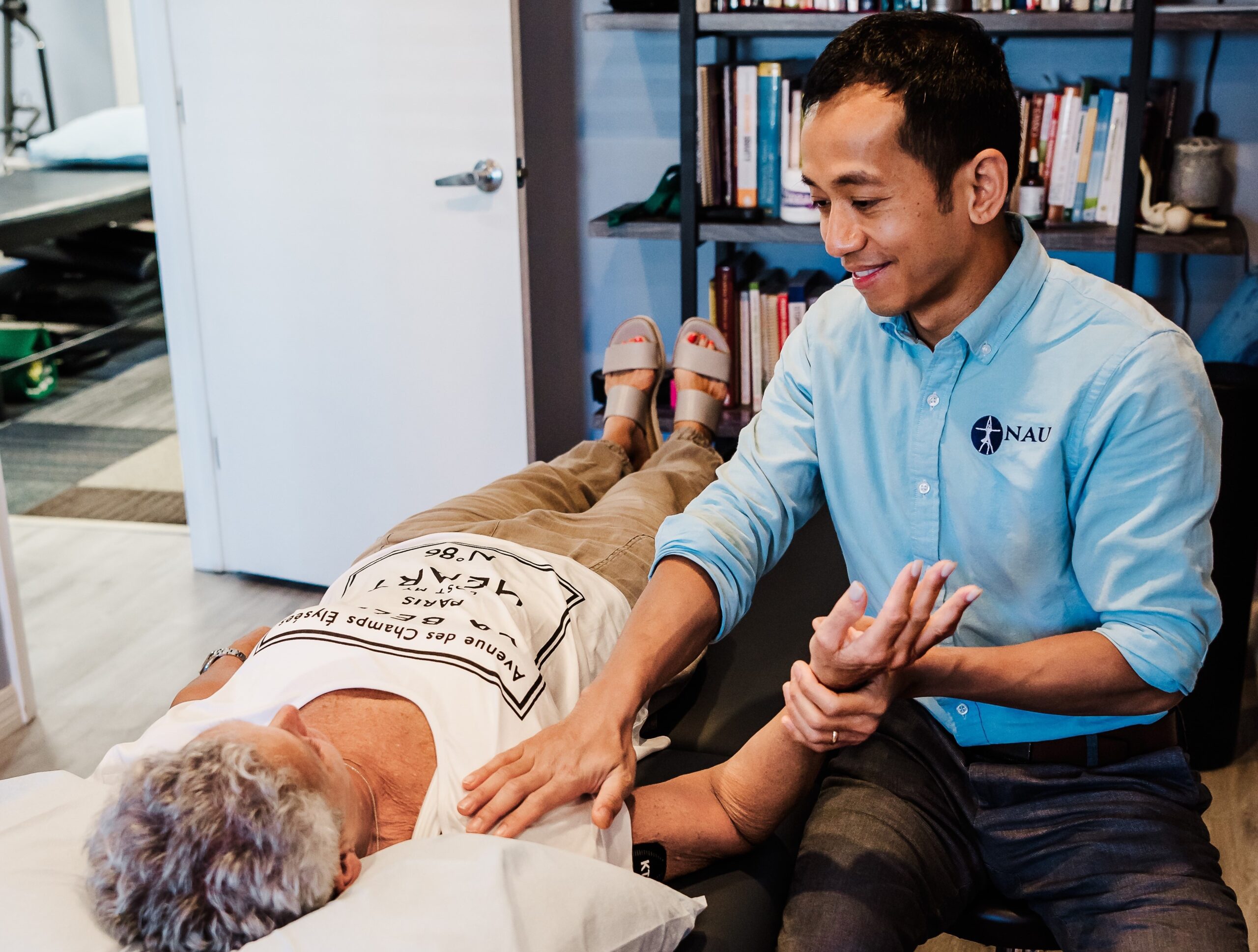 Dr. Sukie Nau helping a patient with manual therapy